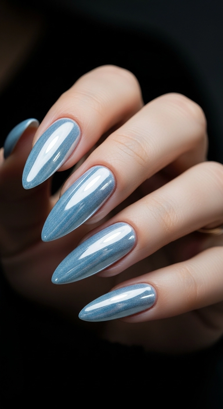 Long almond nails with a super reflective, icy white chrome finish.